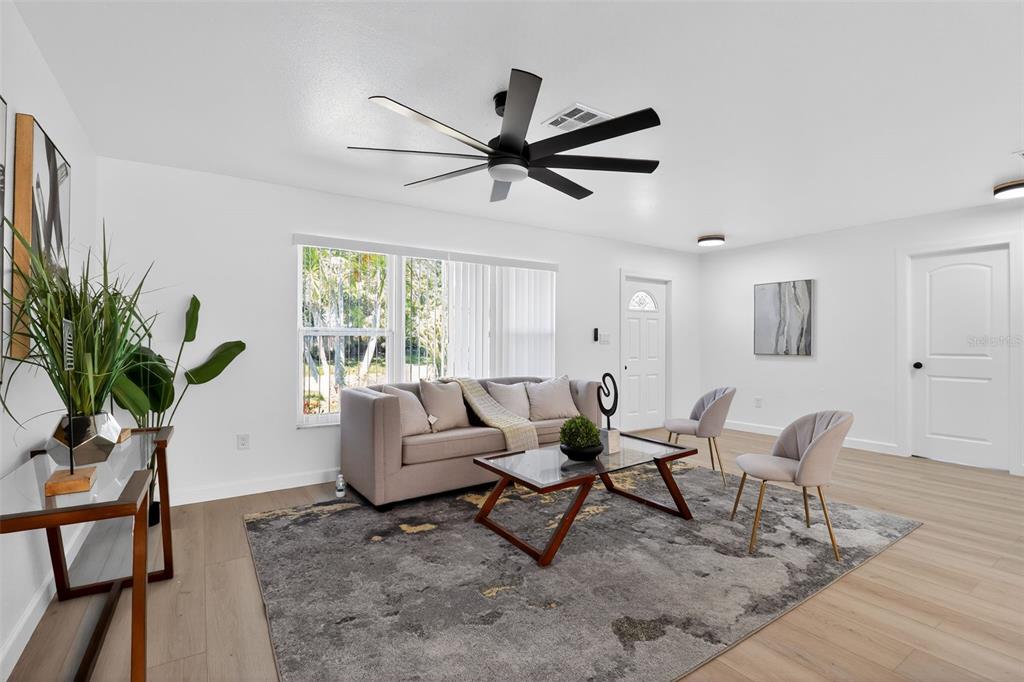 4210 Palm Drive Punta Gorda, FL 33950 - Photo 4 of 30 a living room with furniture and a large window
