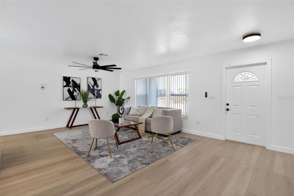 4210 Palm Drive Punta Gorda, FL 33950 - Photo 6 of 30 a living room with furniture and a potted plant