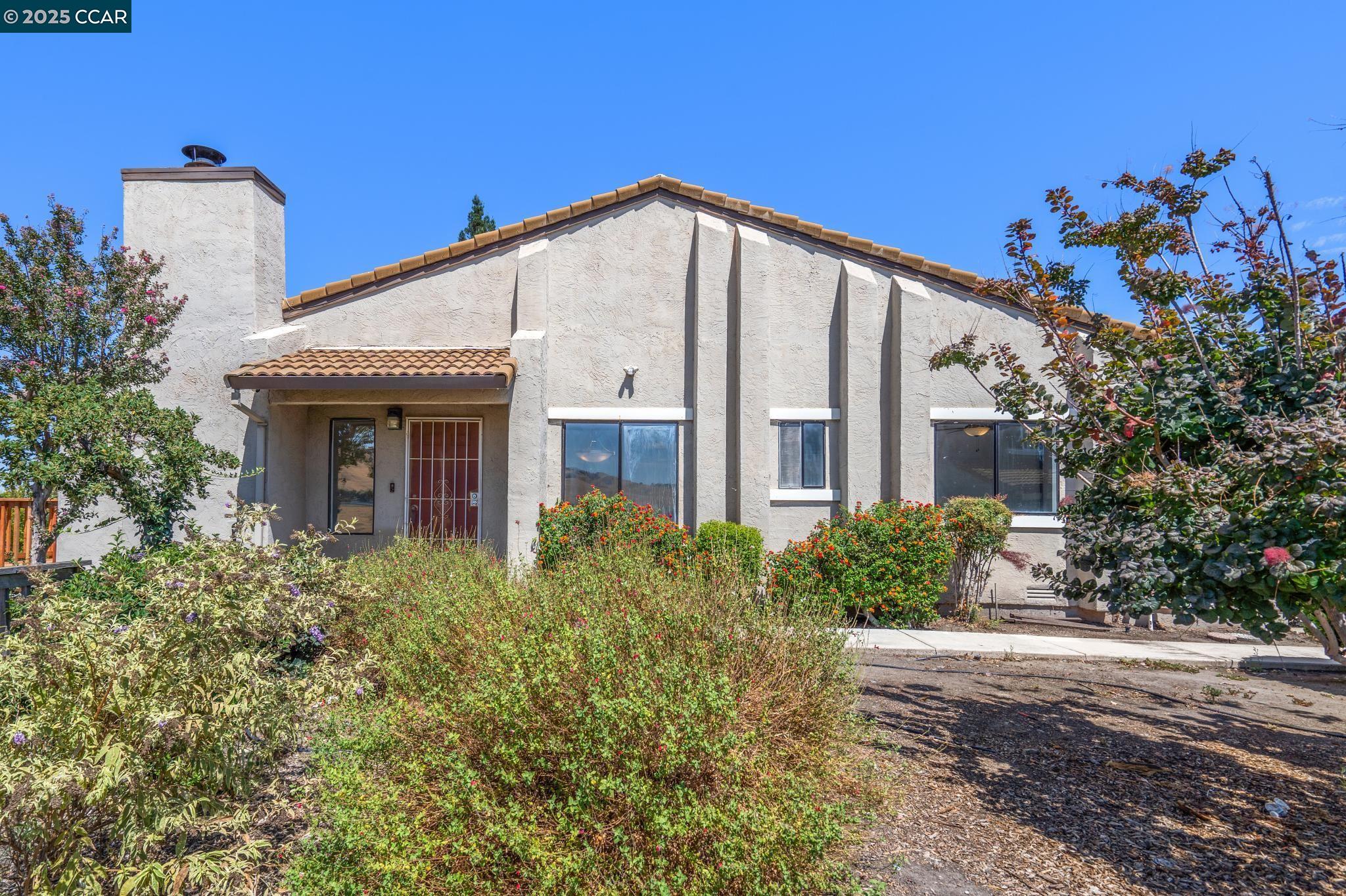3513 Stone Place Antioch, CA 94509 - Photo 1 of 1 a front view of a house with a yard