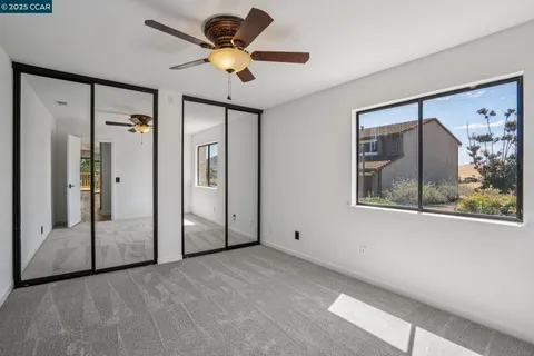 a view of a hallway with a painting on the wall