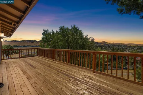 a view of balcony with wooden floor