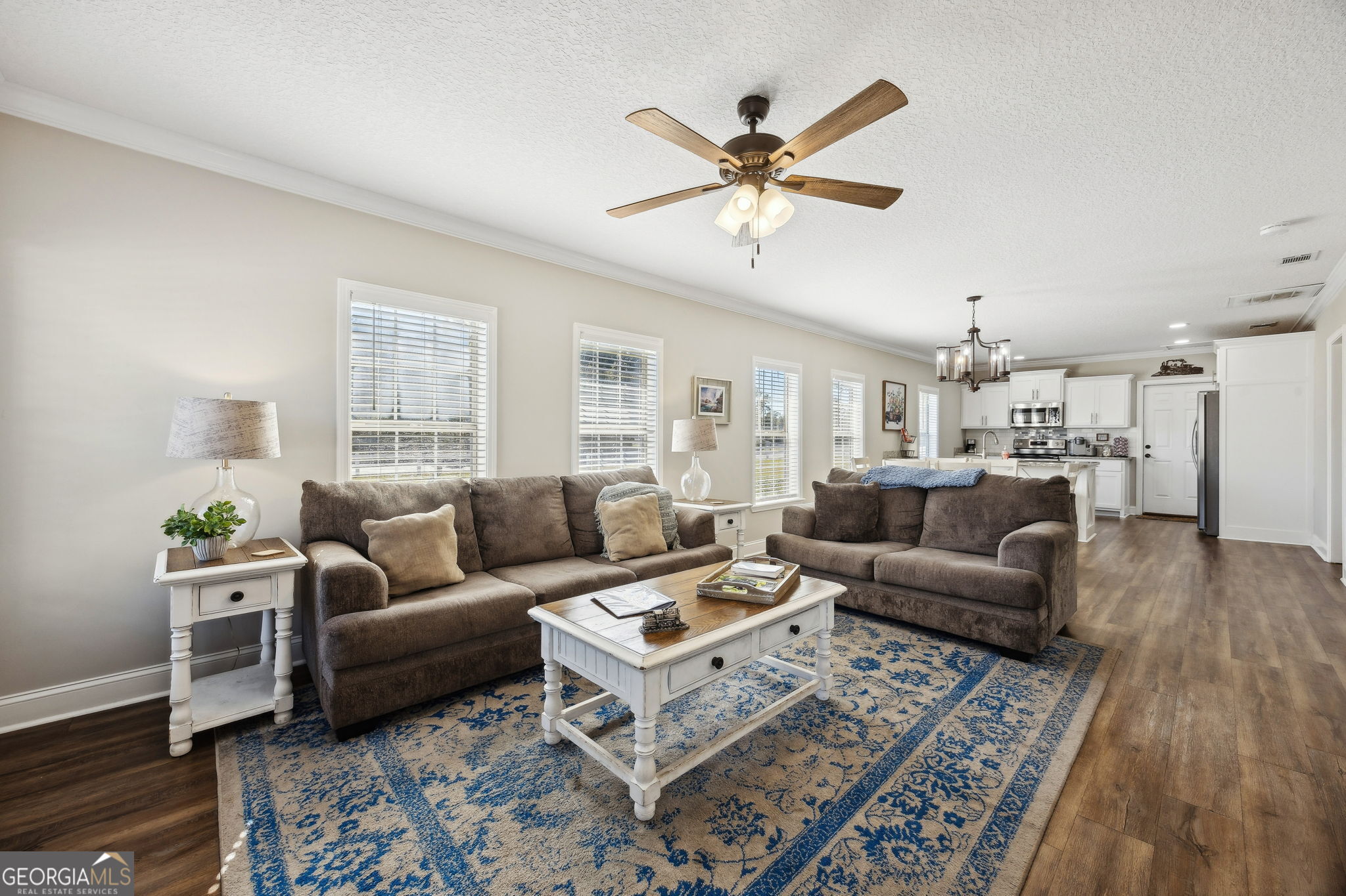 383 1st Street Folkston, GA 31537 - Photo 16 of 81 a living room with furniture and a wooden floor