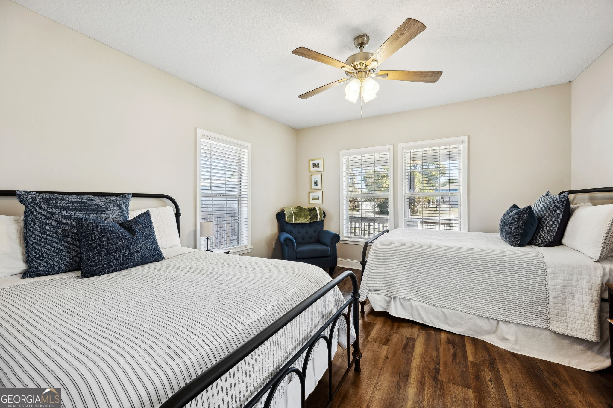 383 1st Street Folkston, GA 31537 - Photo 30 of 81 a bedroom with two beds and a large window