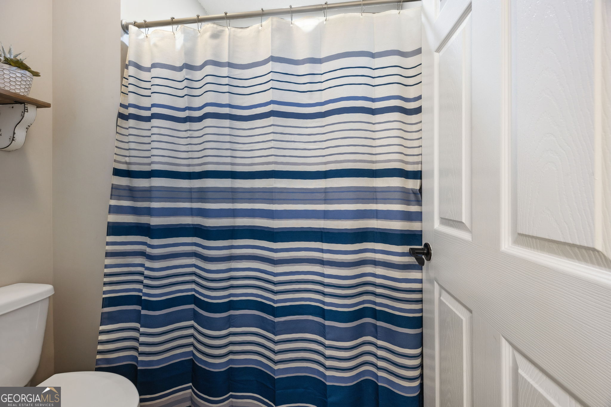 383 1st Street Folkston, GA 31537 - Photo 34 of 81 a bathroom with a sink and a toilet