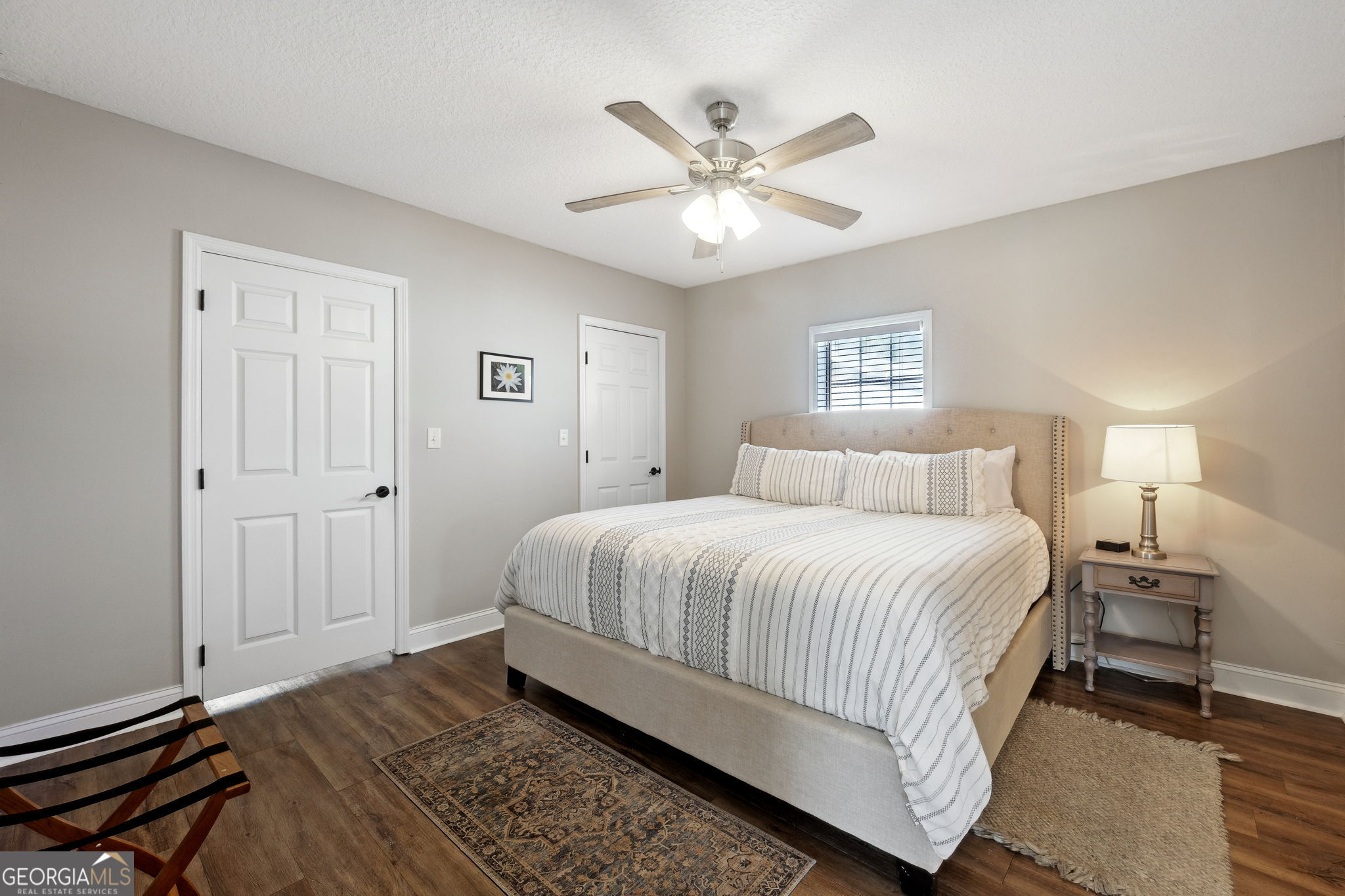 383 1st Street Folkston, GA 31537 - Photo 35 of 81 a bedroom with a bed and a chandelier