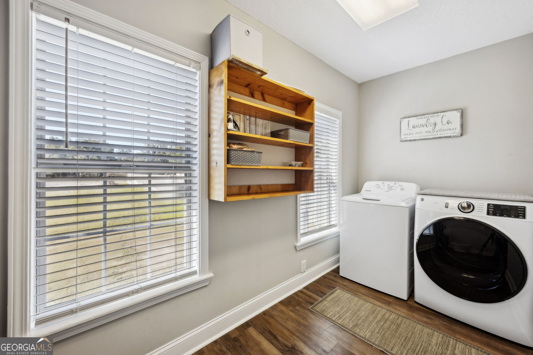 383 1st Street Folkston, GA 31537 - Photo 38 of 81 a view of a storage & utility room with washer and dryer