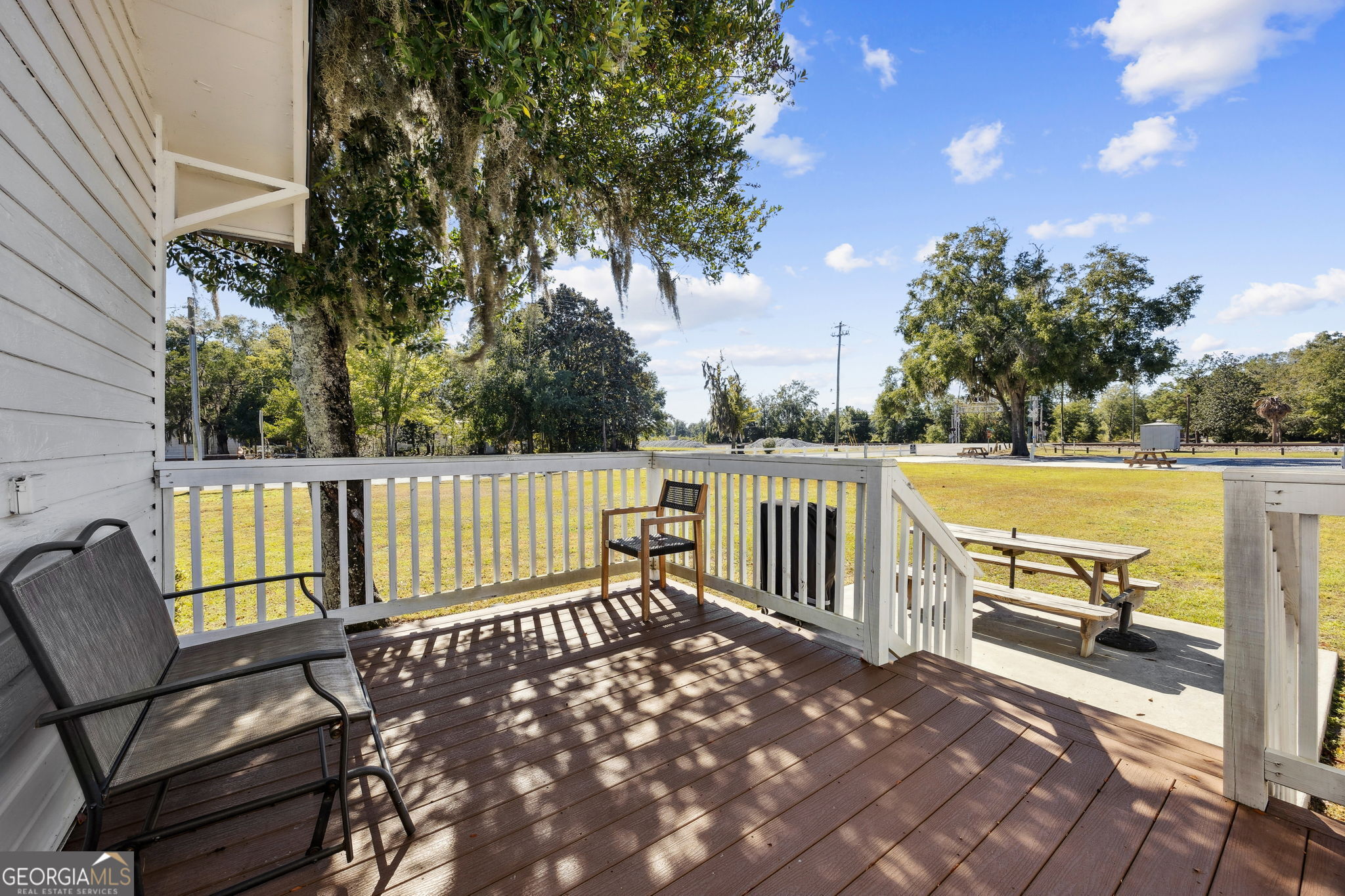 383 1st Street Folkston, GA 31537 - Photo 40 of 81 a view of a bench in the roof deck