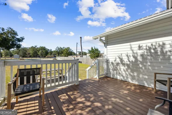 a view of swimming pool with seating area