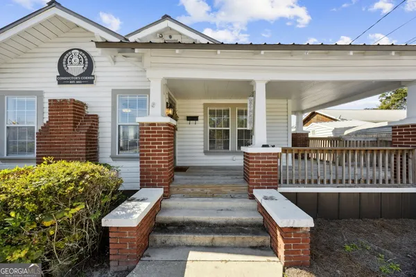 a view of backyard with deck and wooden floor