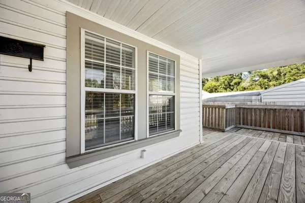 a view of a chairs on wooden deck