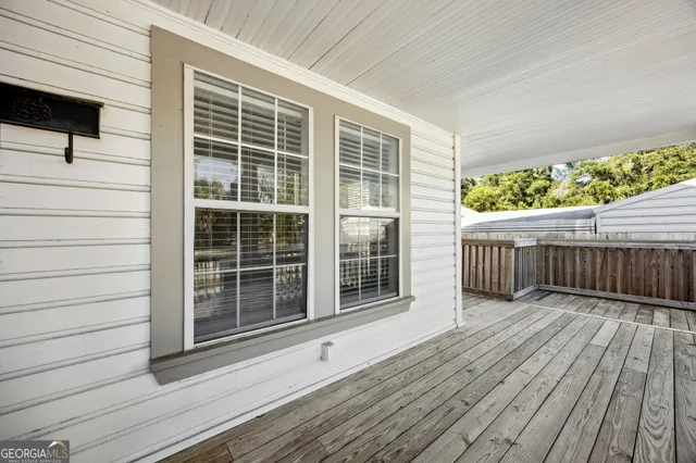 a view of a chairs on wooden deck