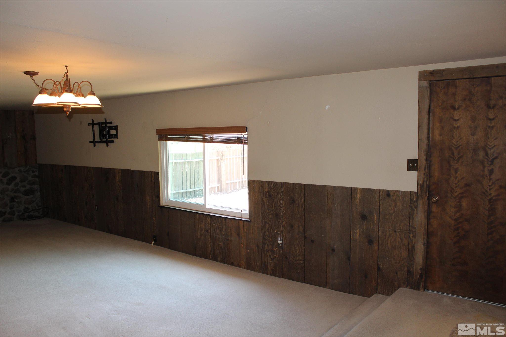 3425 Sorensen Road Fallon, NV 89406 - Photo 15 of 37 a room with a window and a chandelier fan