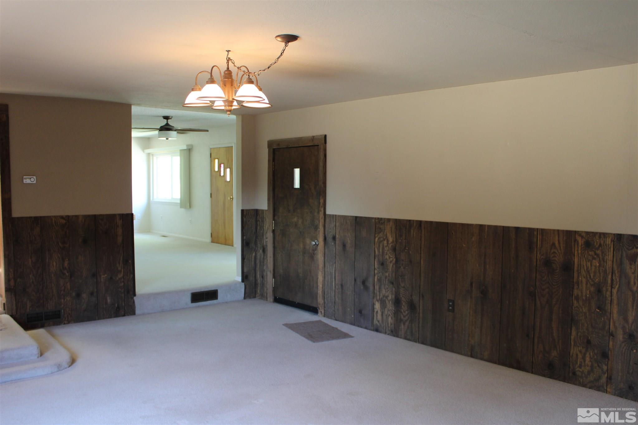 3425 Sorensen Road Fallon, NV 89406 - Photo 16 of 37 wooden floor in an empty room with a window