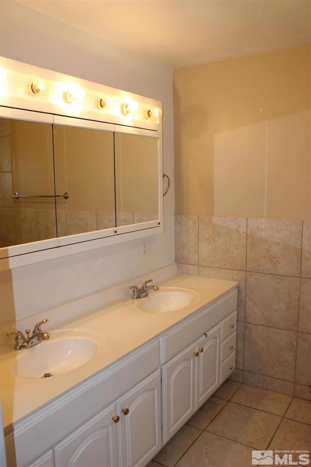 3425 Sorensen Road Fallon, NV 89406 - Photo 20 of 37 a bathroom with a sink and a mirror