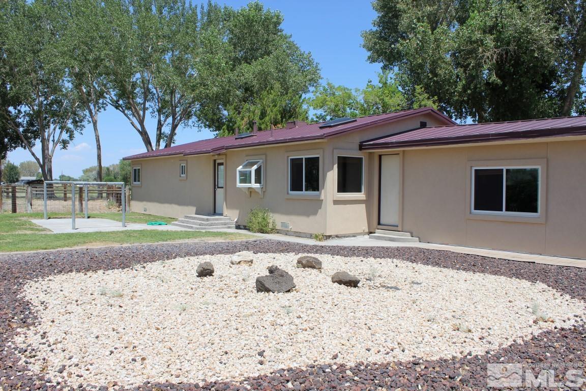 3425 Sorensen Road Fallon, NV 89406 - Photo 2 of 37 a front view of a house with a yard