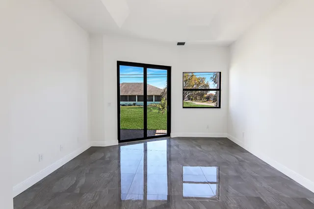 a bathroom with a tub a sink and mirror