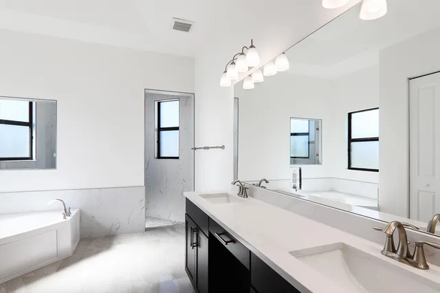 a bathroom with a sink and a shower