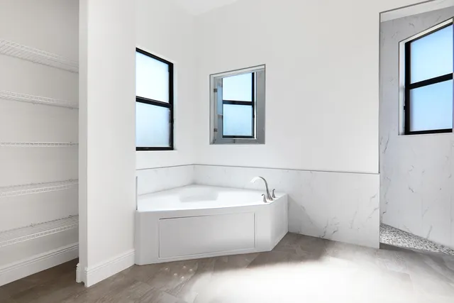 a view of a kitchen with refrigerator and kitchen