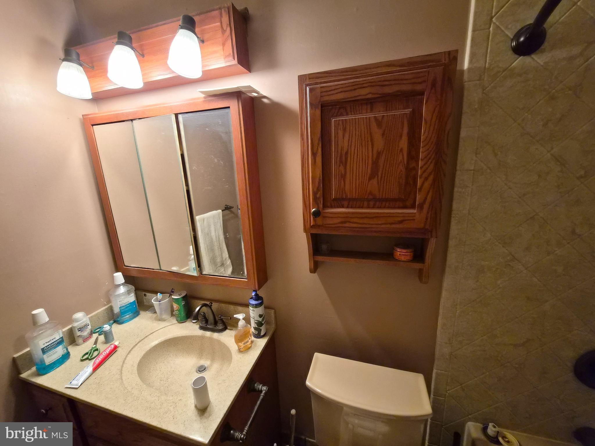 157 Edge Lane Willingboro, NJ 08046 - Photo 17 of 27 a bathroom with a sink a toilet and mirror