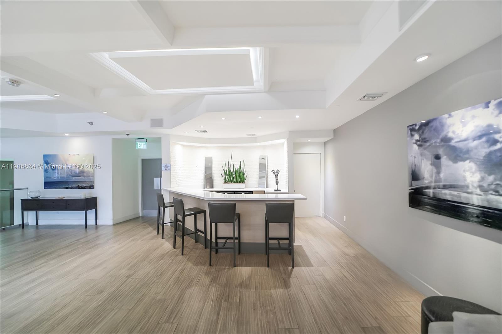 100 Lincoln Road, Unit 1201 Miami Beach, FL 33139 - Photo 17 of 19 a view of a dining room with furniture and wooden floor