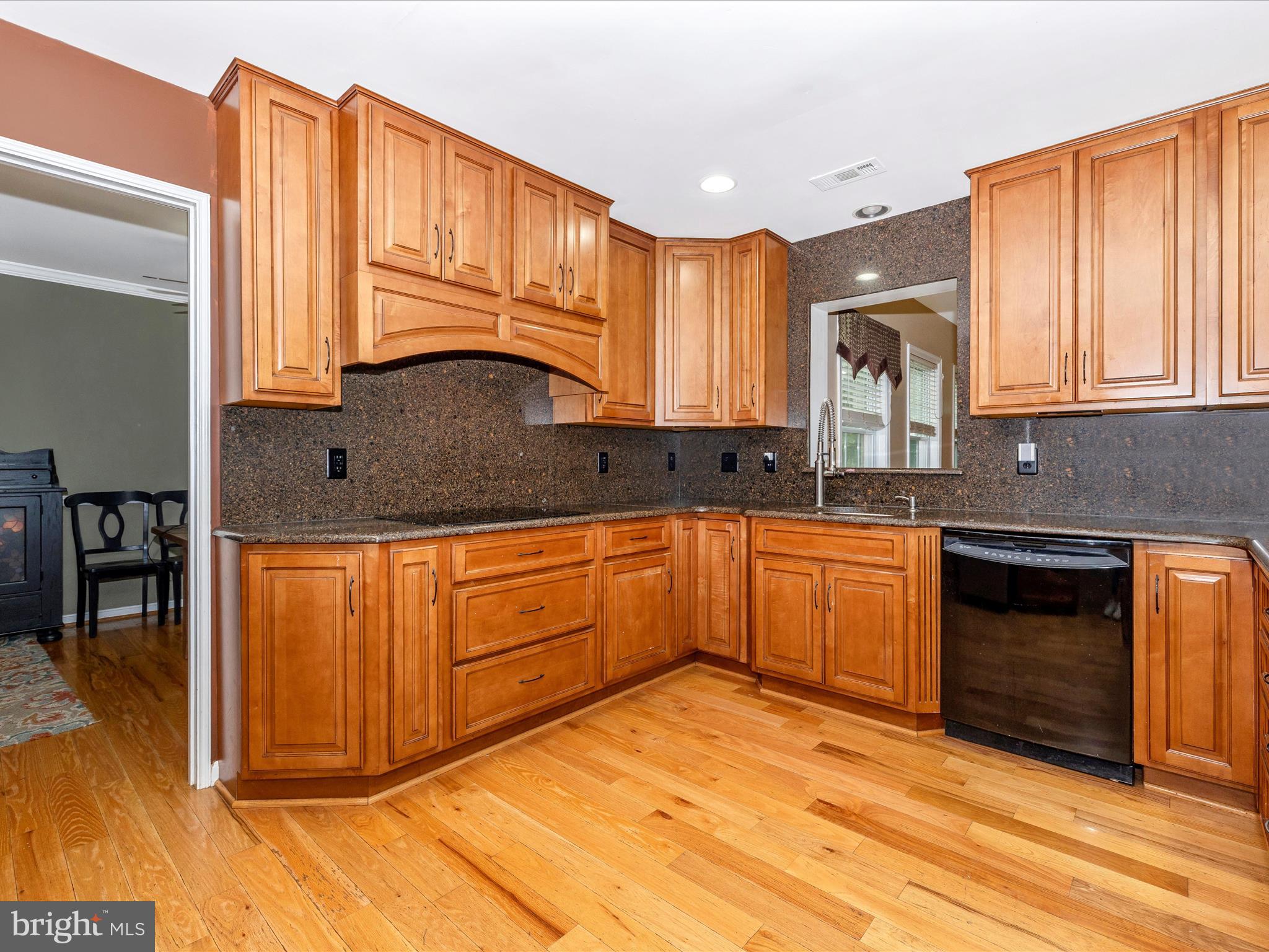 5880 Union Ridge Drive Adamstown, MD 21710 - Photo 17 of 49 a kitchen with stainless steel appliances granite countertop a stove a sink and a microwave