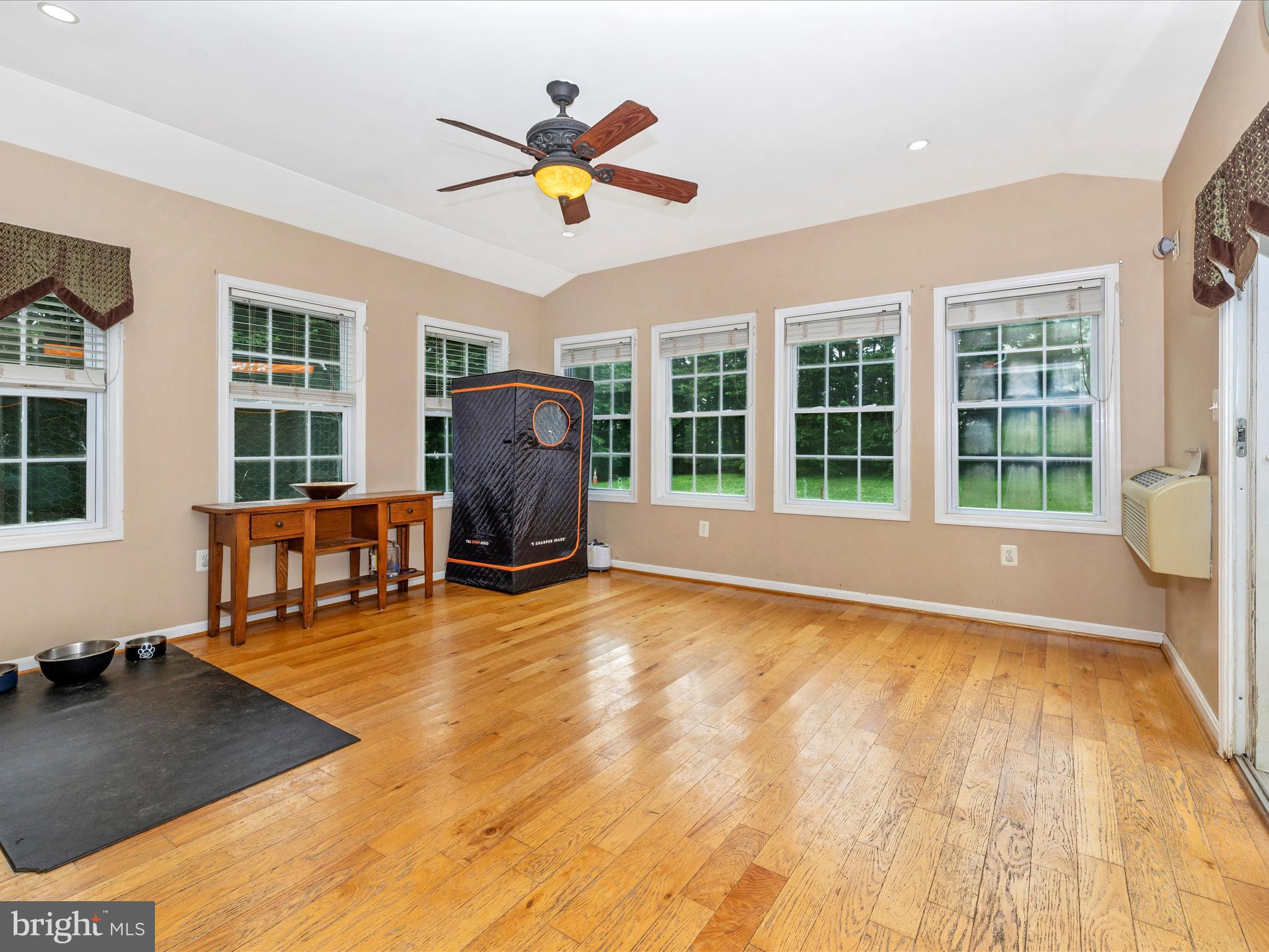 5880 Union Ridge Drive Adamstown, MD 21710 - Photo 23 of 49 a view of a livingroom with wooden floor and a ceiling fan