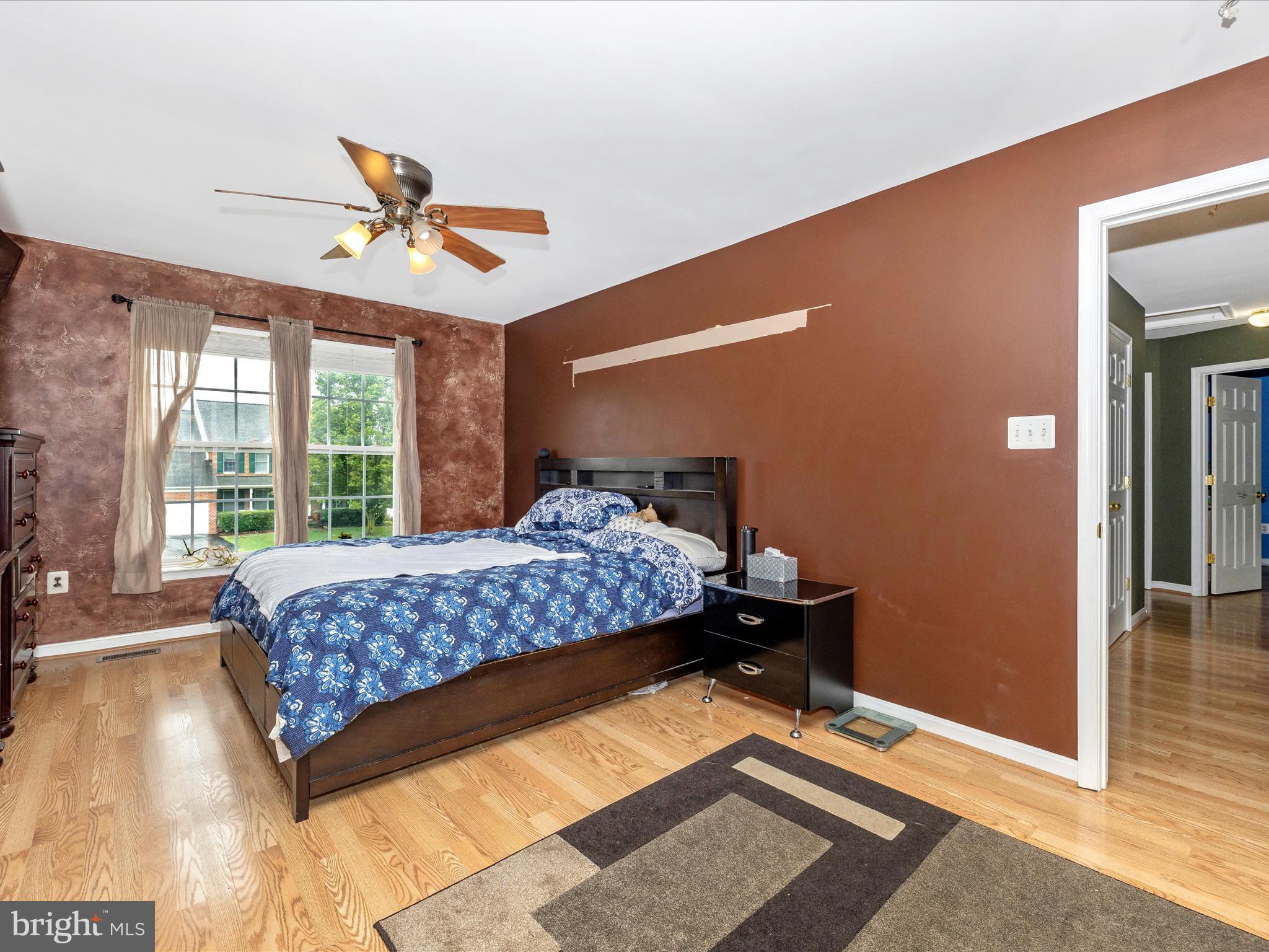 5880 Union Ridge Drive Adamstown, MD 21710 - Photo 28 of 49 a bedroom with a bed and wooden floor