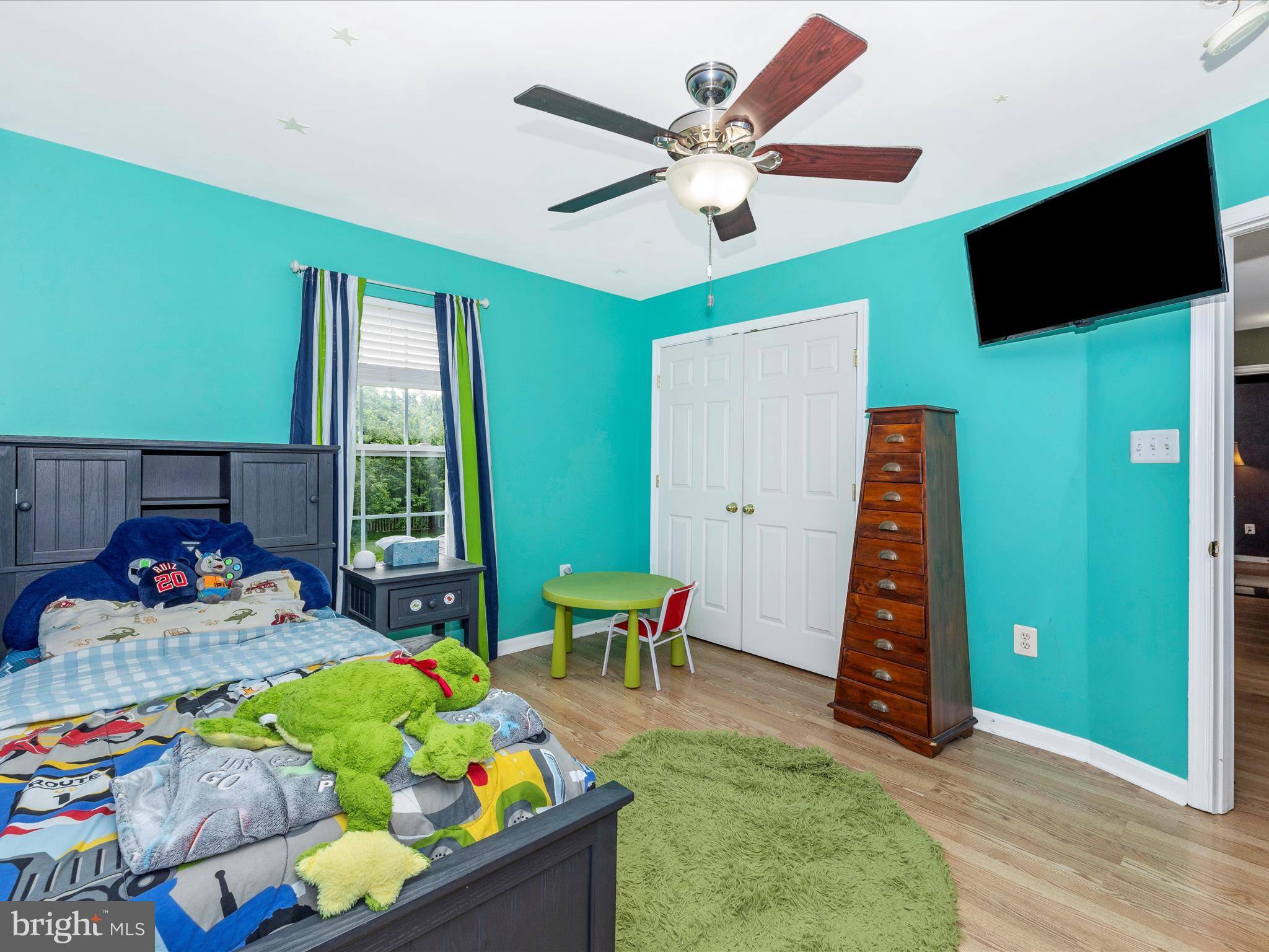 5880 Union Ridge Drive Adamstown, MD 21710 - Photo 32 of 49 a living room with furniture and a flat screen tv