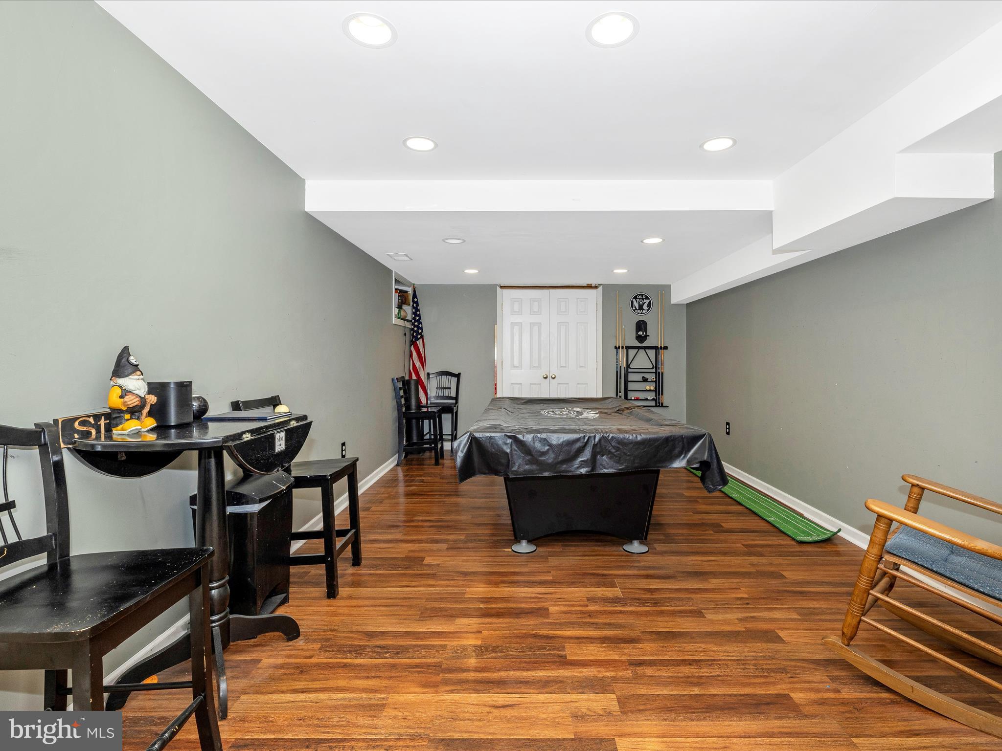 5880 Union Ridge Drive Adamstown, MD 21710 - Photo 39 of 49 a living room with furniture and a wooden floor
