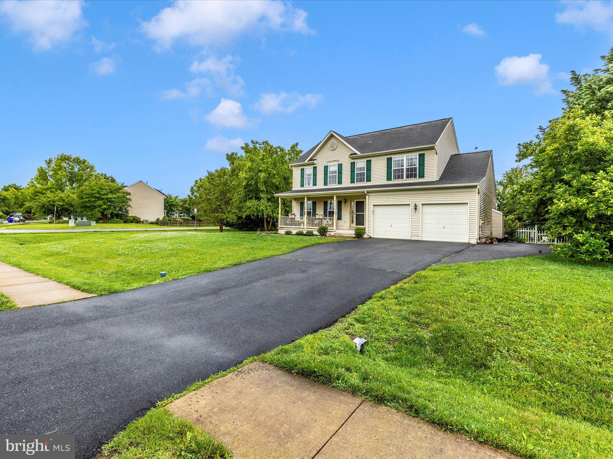 5880 Union Ridge Drive Adamstown, MD 21710 - Photo 4 of 49 a front view of a house with a yard and garage