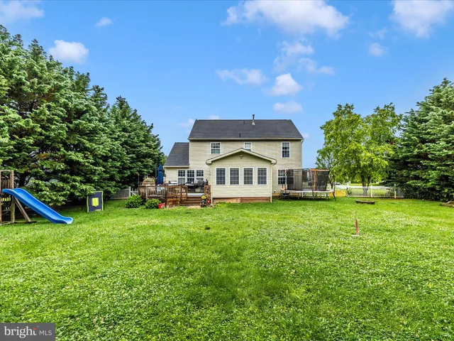 a view of a house with a big yard