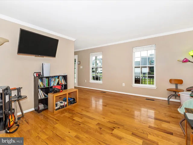 a room with furniture and a flat screen tv