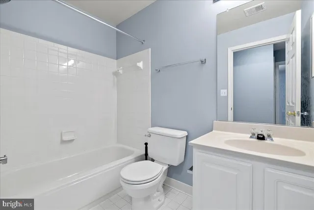 a bathroom with a sink toilet a mirror and shower