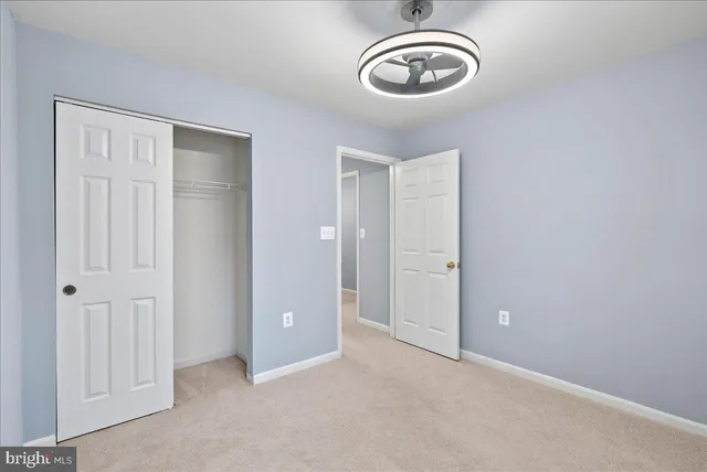 a view of a room with rack and wooden floor