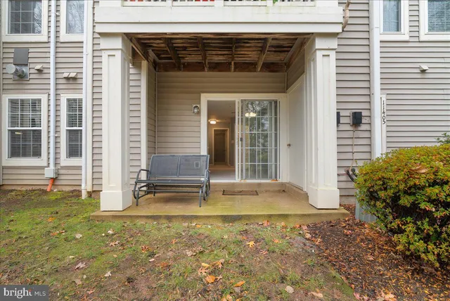 a view of a house with backyard and porch