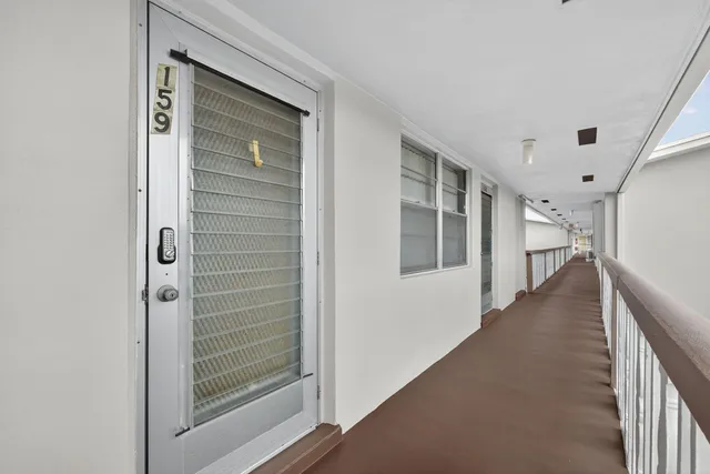 a view of a hallway with staircase