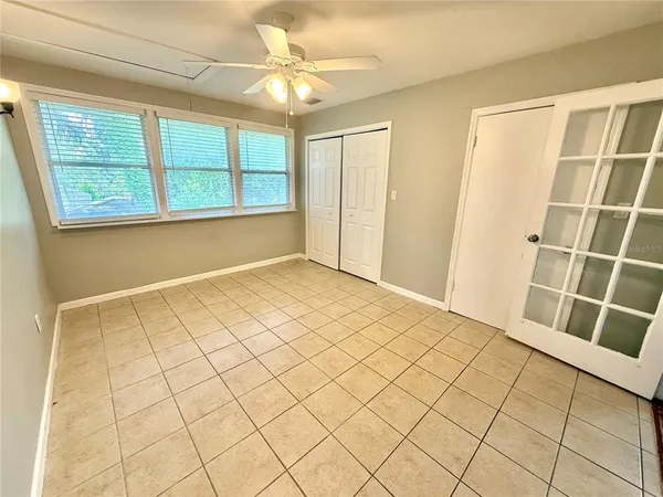 a view of an empty room with a window