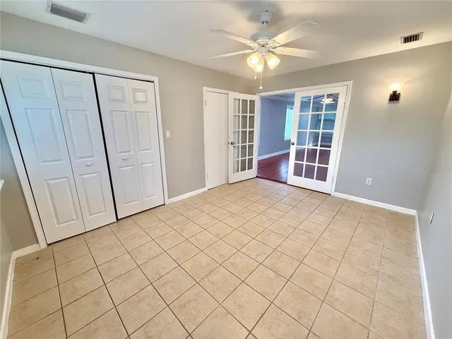 a view of empty room with windows