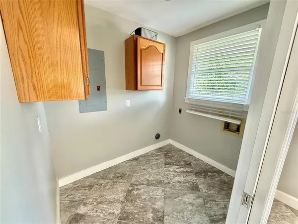 a bathroom with a window and a shower