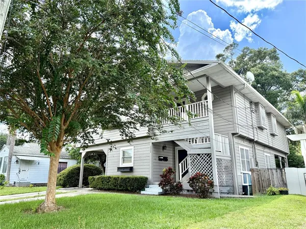 a view of a house with a yard