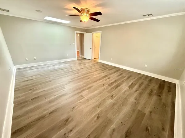 a view of an empty room with a window