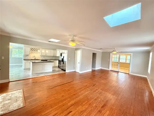 a view of a kitchen with wooden floor