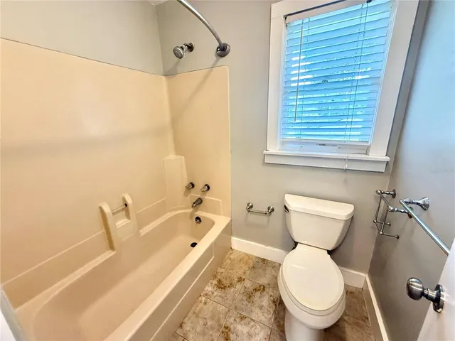 a bathroom with a toilet a sink and a bathtub
