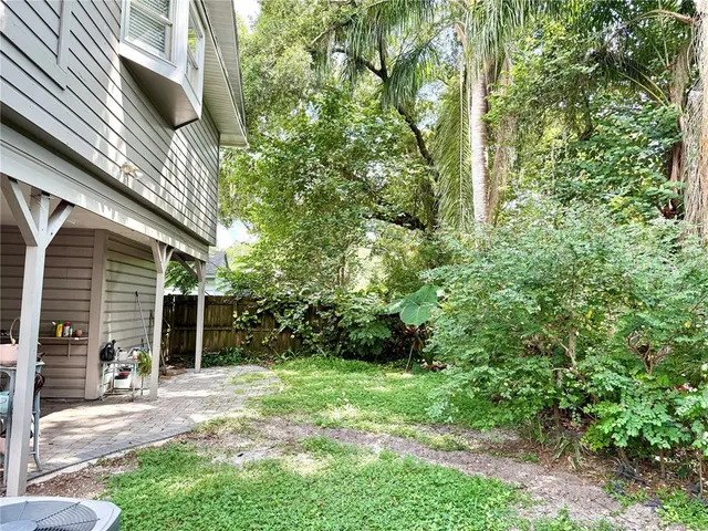 a view of a back yard of the house