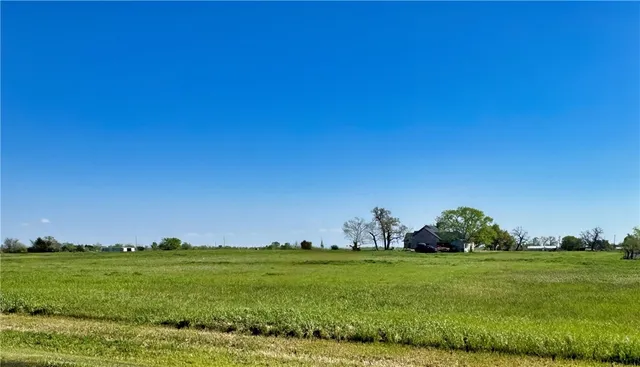 an aerial view of residential houses with outdoor space and swimming pool