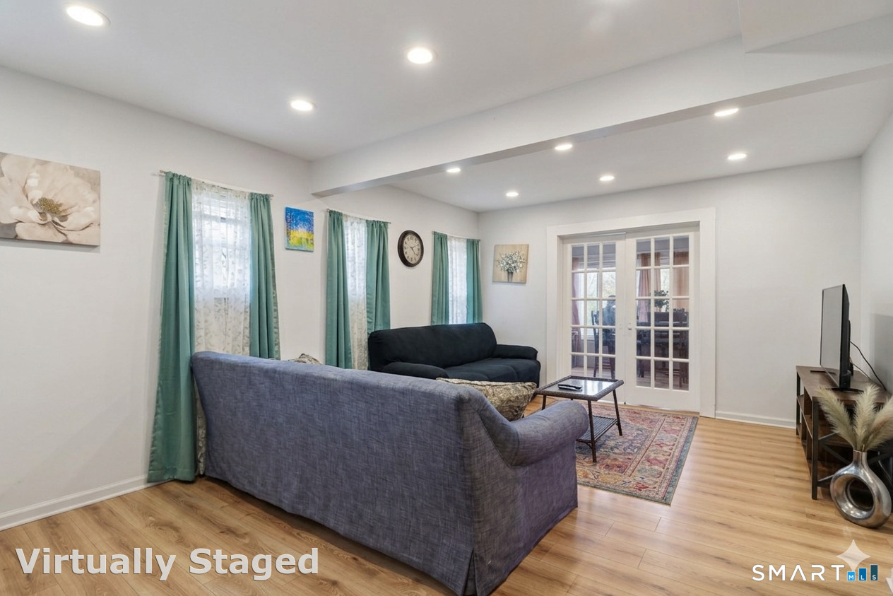 37 Manhan Street Waterbury, CT 06710 - Photo 4 of 19 a living room with furniture and a flat screen tv