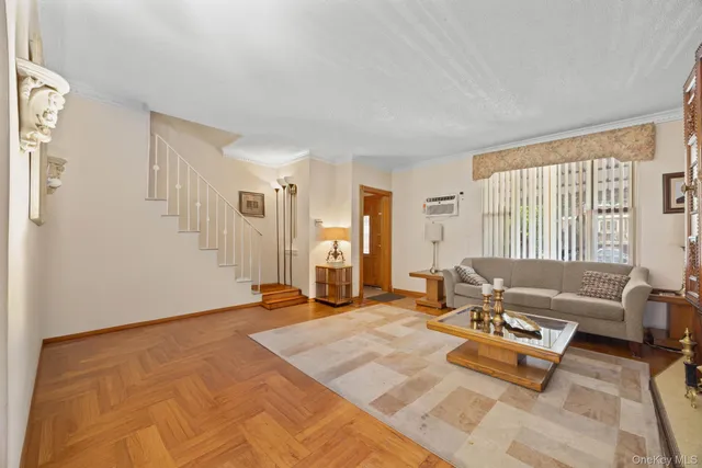 a living room with furniture and large window