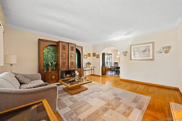 a living room with furniture gym equipment and a large window
