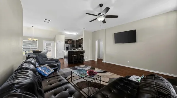 a kitchen with stainless steel appliances granite countertop a refrigerator stove a sink and dishwasher