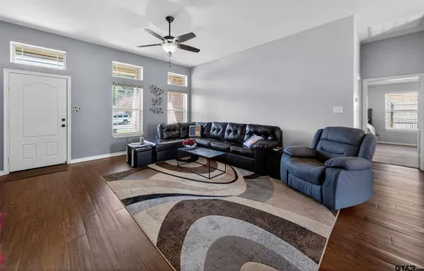 a kitchen with stainless steel appliances granite countertop a refrigerator stove top oven and sink